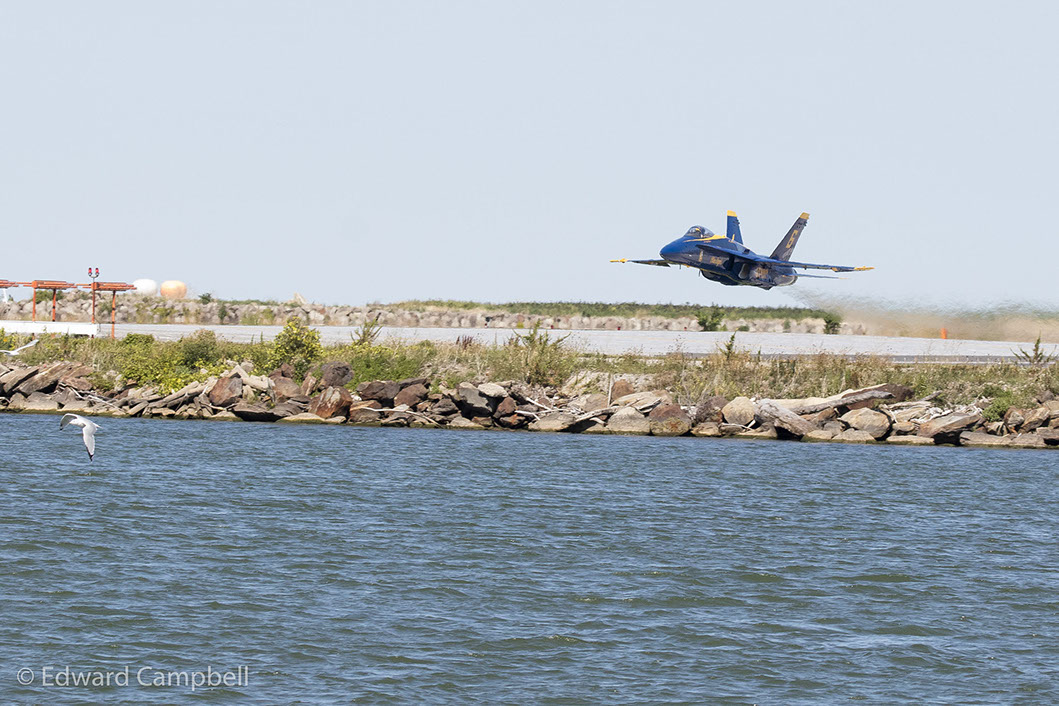 Commander Frank Weisser in Blue Angel 6 accelerates for a low pass as the U.S. Navy Blue Angels perform at the 2016 Cleveland National Air Show.
