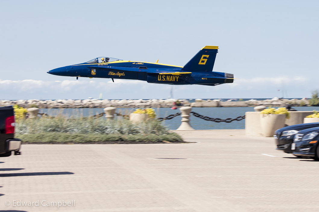 Commander Frank Weisser in Blue Angel 6 makes a low pass as the U.S. Navy Blue Angels perform at the 2016 Cleveland National Air Show.